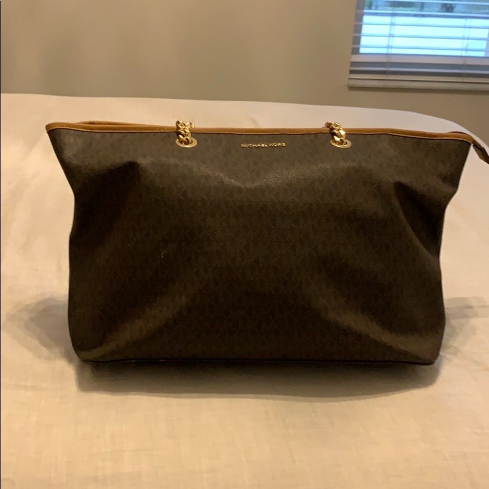 Brown Michael kors bag there is a little wear